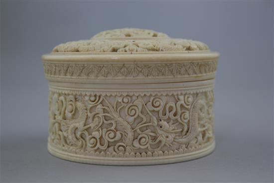 A Chinese ivory dragon drum shaped box and cover, early 20th century, diam. 10.5cm